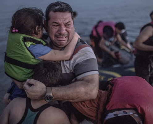 Laith Majid cries tears of joy and relief that he and his children have made it to Europe. Photograph: Daniet Etter/New York Times/Redux /eyevine