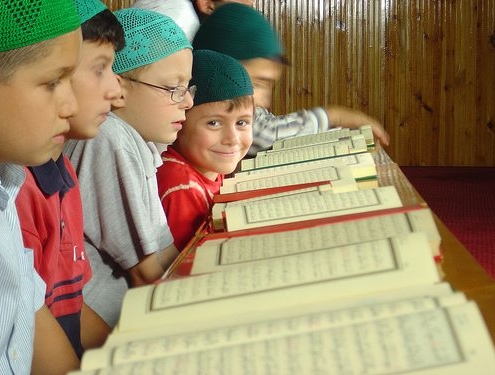 child reciting the holy quran