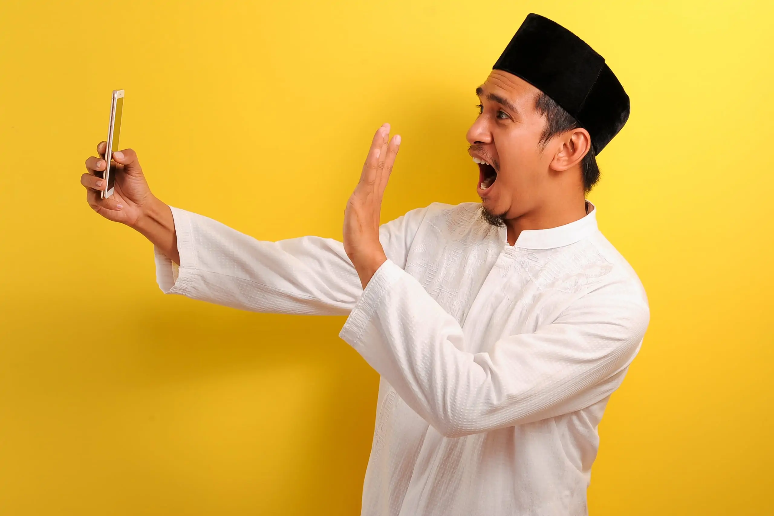 Happy,Shock,Young,Asian,Muslim,Man,Wearing,Muslim,Clothes,Holding