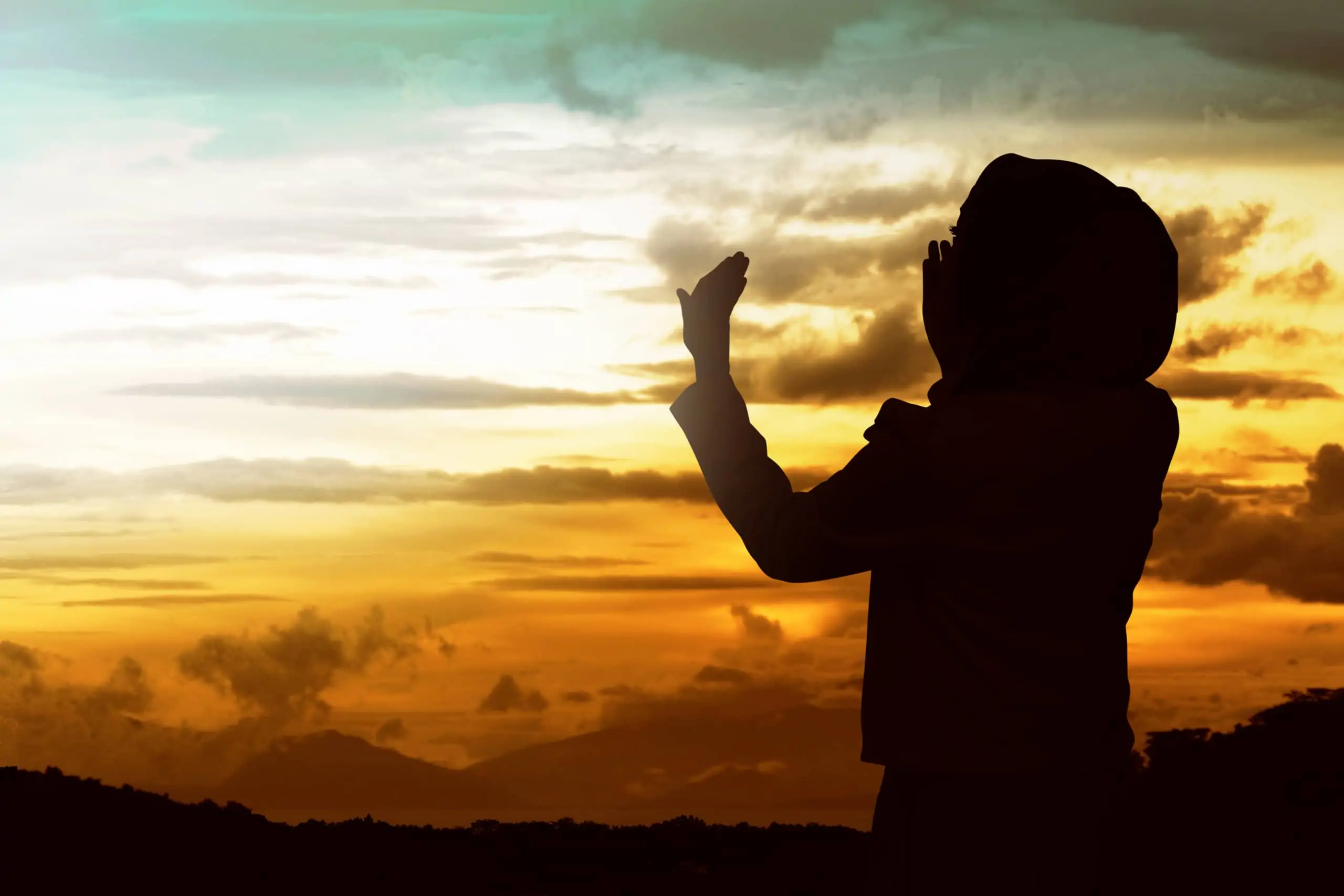 Back,View,Of,Muslim,Woman,Praying,Wearing,Hijab